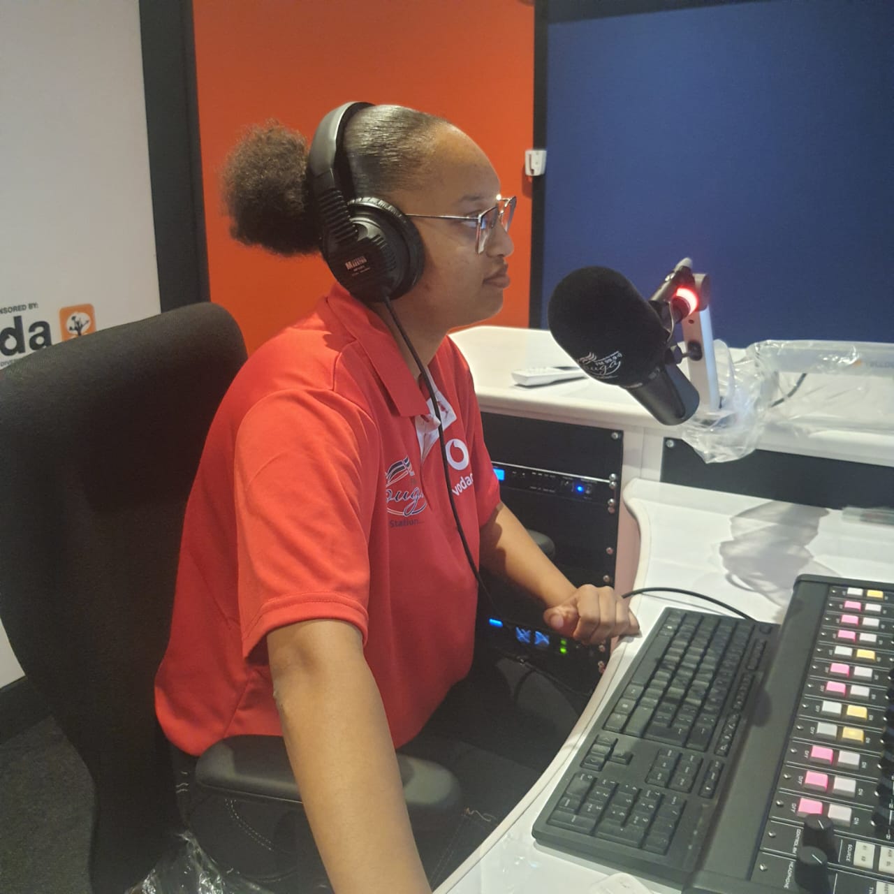 Kouga FM presenter on air at the studio mixing desk