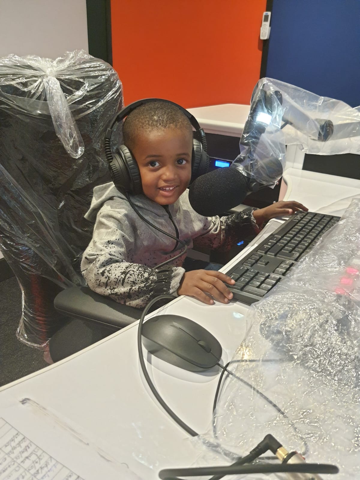 Young listener on the mic in the Kouga FM studio